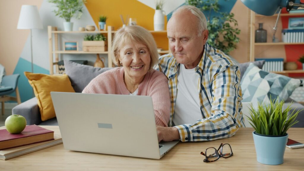 Older couple reviewing information on a computer at home